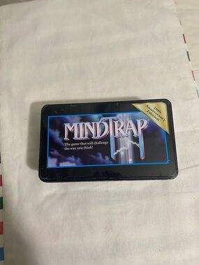 MindTrap 10th Anniversary Edition Game Tin - Black with Purple Artwork